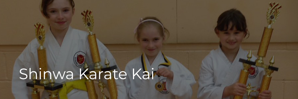 Shinwa Karate Kai - students collecting trophies